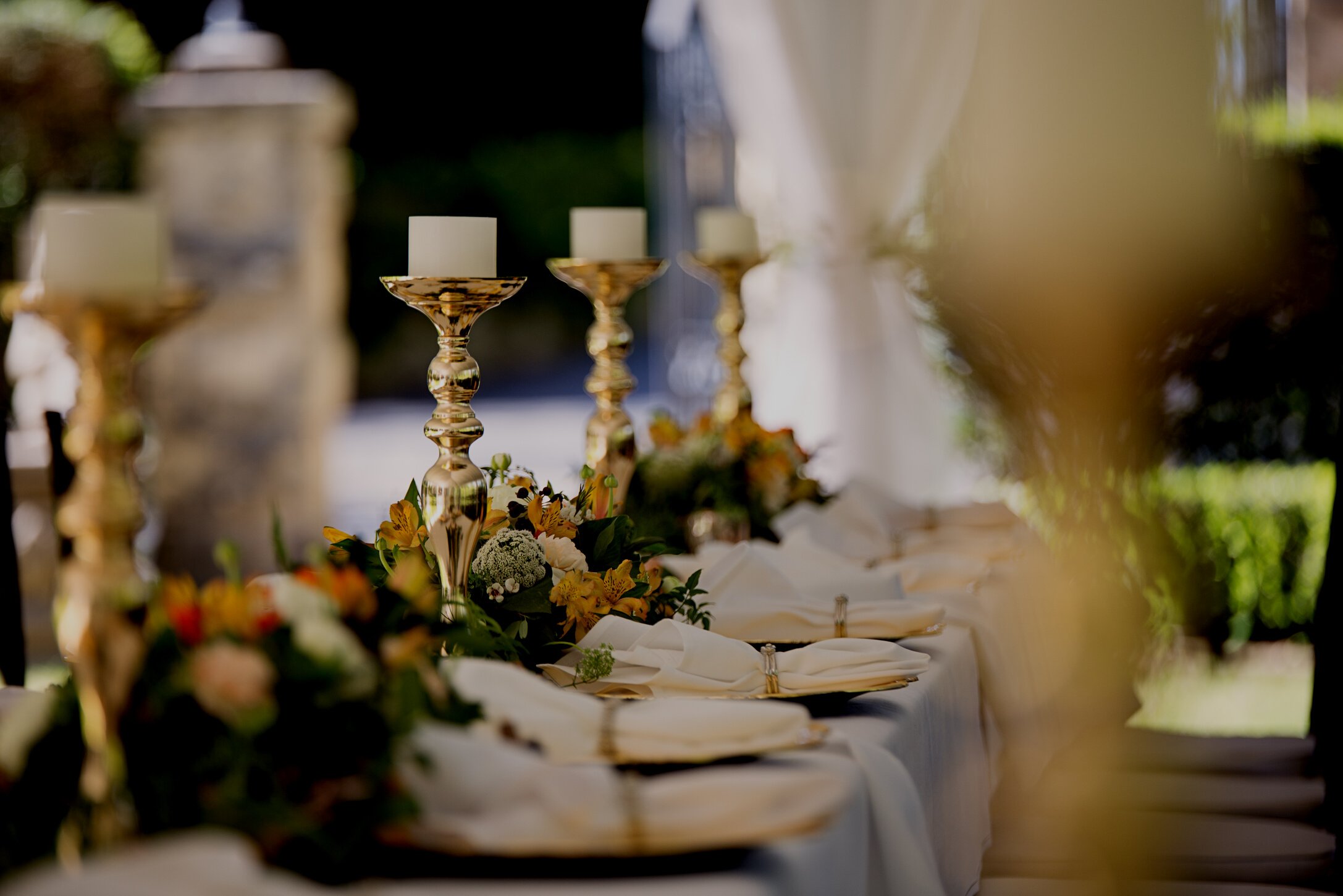 Selective Focus of Candlesticks on Table With Wedding Set-up